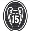 black and white patch with the number fifteen in it's center, surrounded
