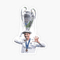 man holding up a trophy with his hands in the air and wearing a hat