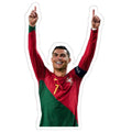 man in a red and green shirt is holding his hands up to the sky