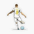 man kicking a soccer ball on top of a white field with the number 8 on it